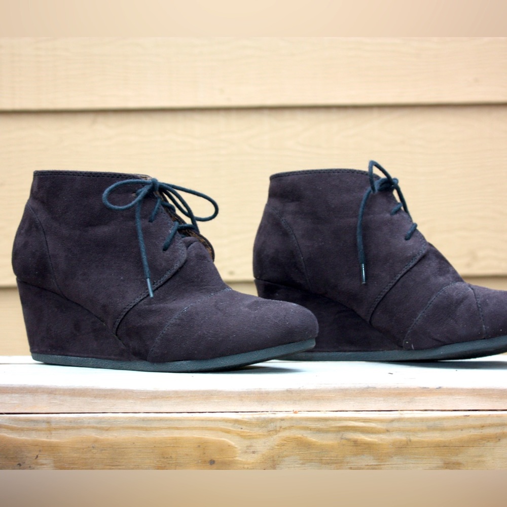 Black, wedge, boots with laces. Material is soft to touch and slightly fuzzy.